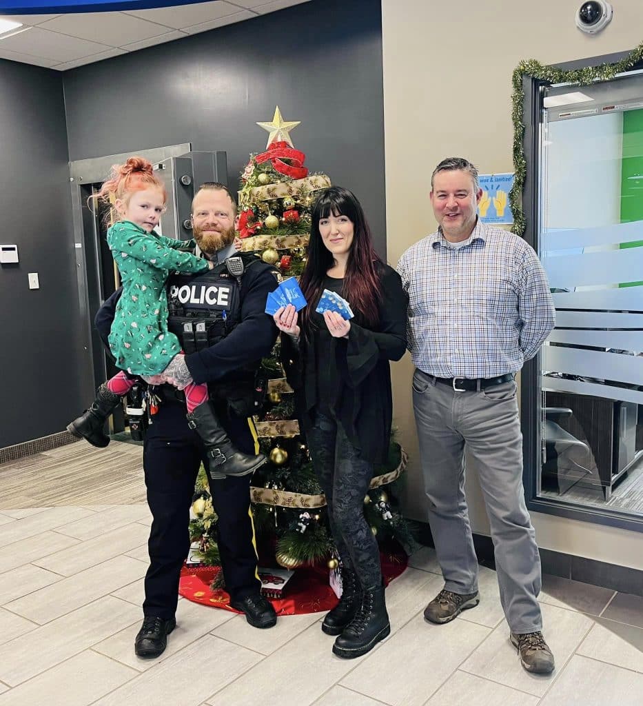 Freyja, Erich and JJ Schmidt beside Ted Pahl at North Peace Savings and Credit Union. (JJ Schmidt - Supplied)